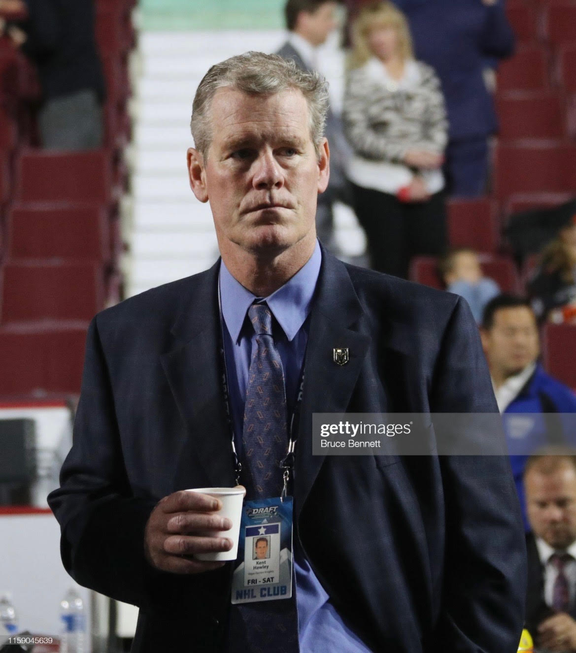Kent Hawley scouting or reviewing film